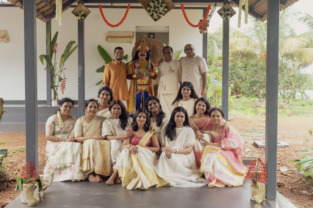 Guests in traditional Kerala attire at a ceremony in the pavilion at Giby Farm