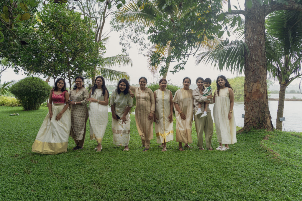 Guests in traditional attire celebrating on the lawn at Giby Farm