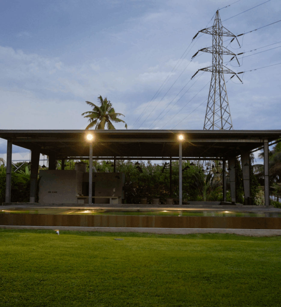 Event pavilion at Giby Farm lit at dusk, ready for a celebration