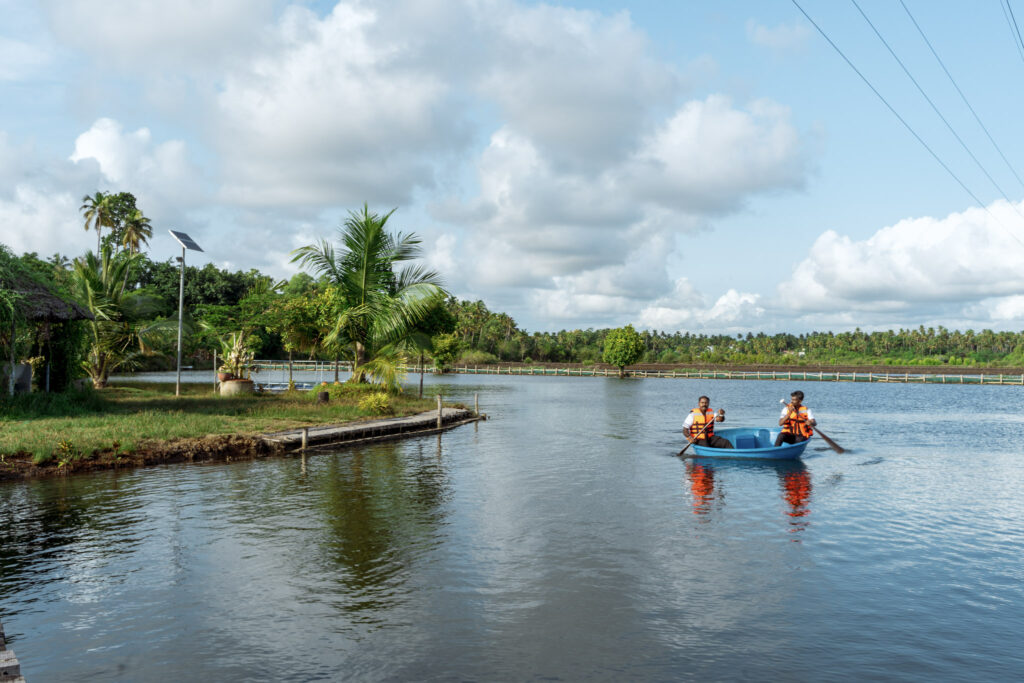 Two guests kayaking on the backwaters at Giby Farm