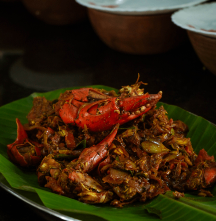 Kerala style crab roast served on a banana leaf at Giby Farm