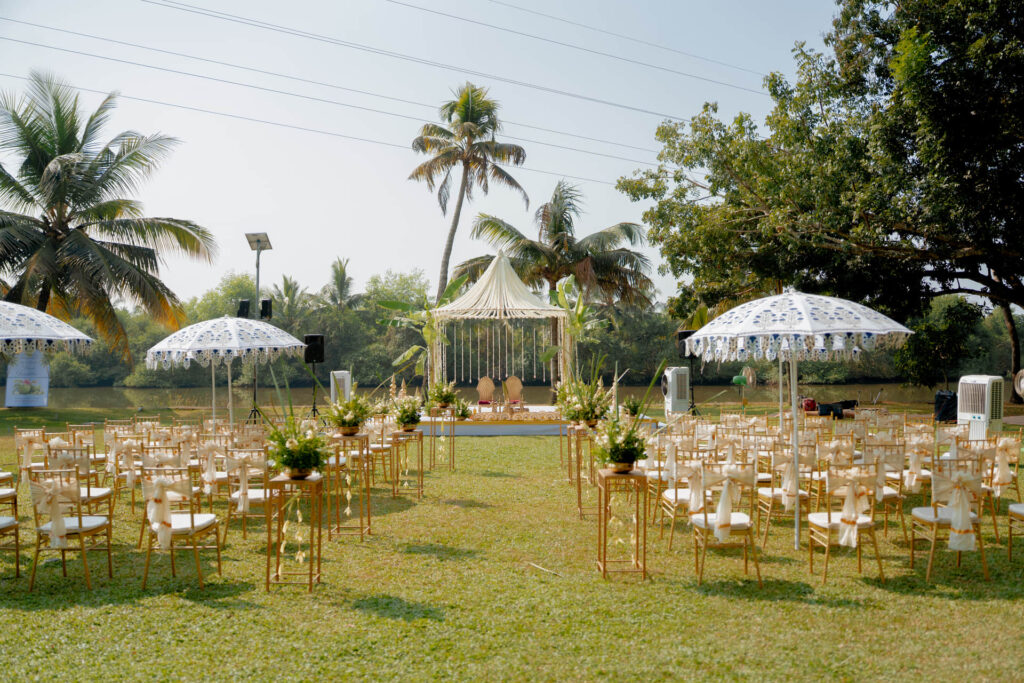 Outdoor wedding setup with white marquees and chairs on the lawn at Giby Farm