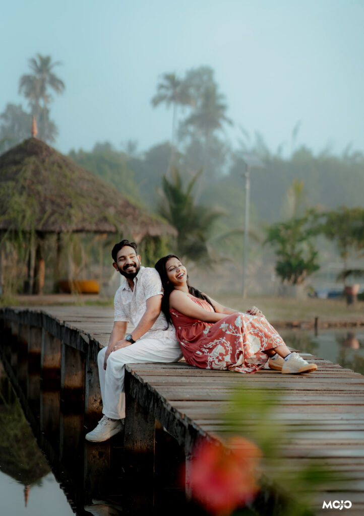 Couple in traditional attire photographed on the wooden jetty at Giby Farm