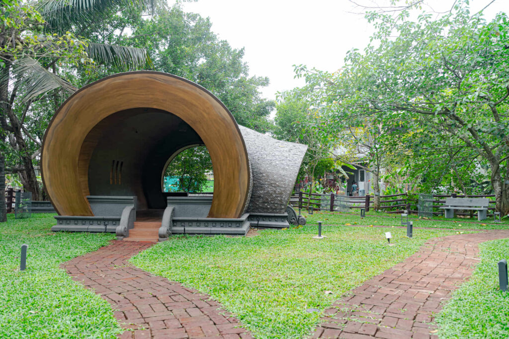 Dome cottage with a brick path at the Nakshatra Vanam garden, Giby Farm