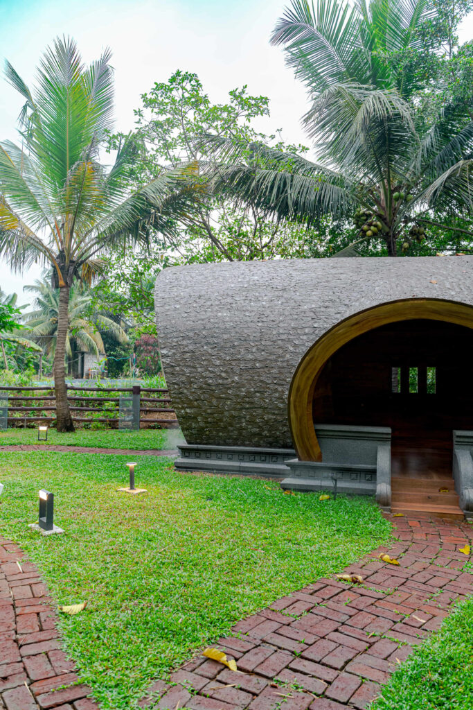 Dome cottage among coconut palms at the Nakshatra Vanam garden, Giby Farm
