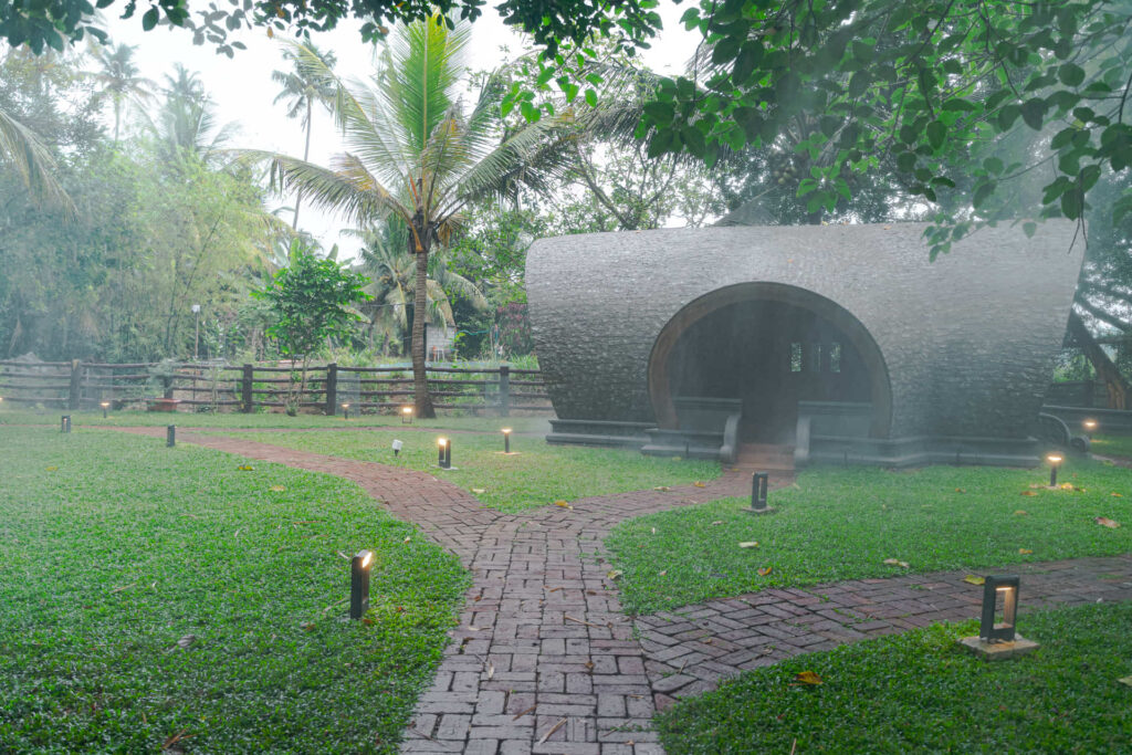 Dome cottage on a misty lawn at the Nakshatra Vanam garden, Giby Farm