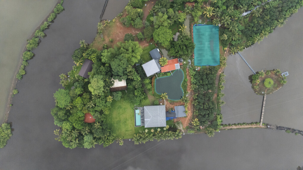 Aerial view of Giby Farm island cottages and surrounding backwater