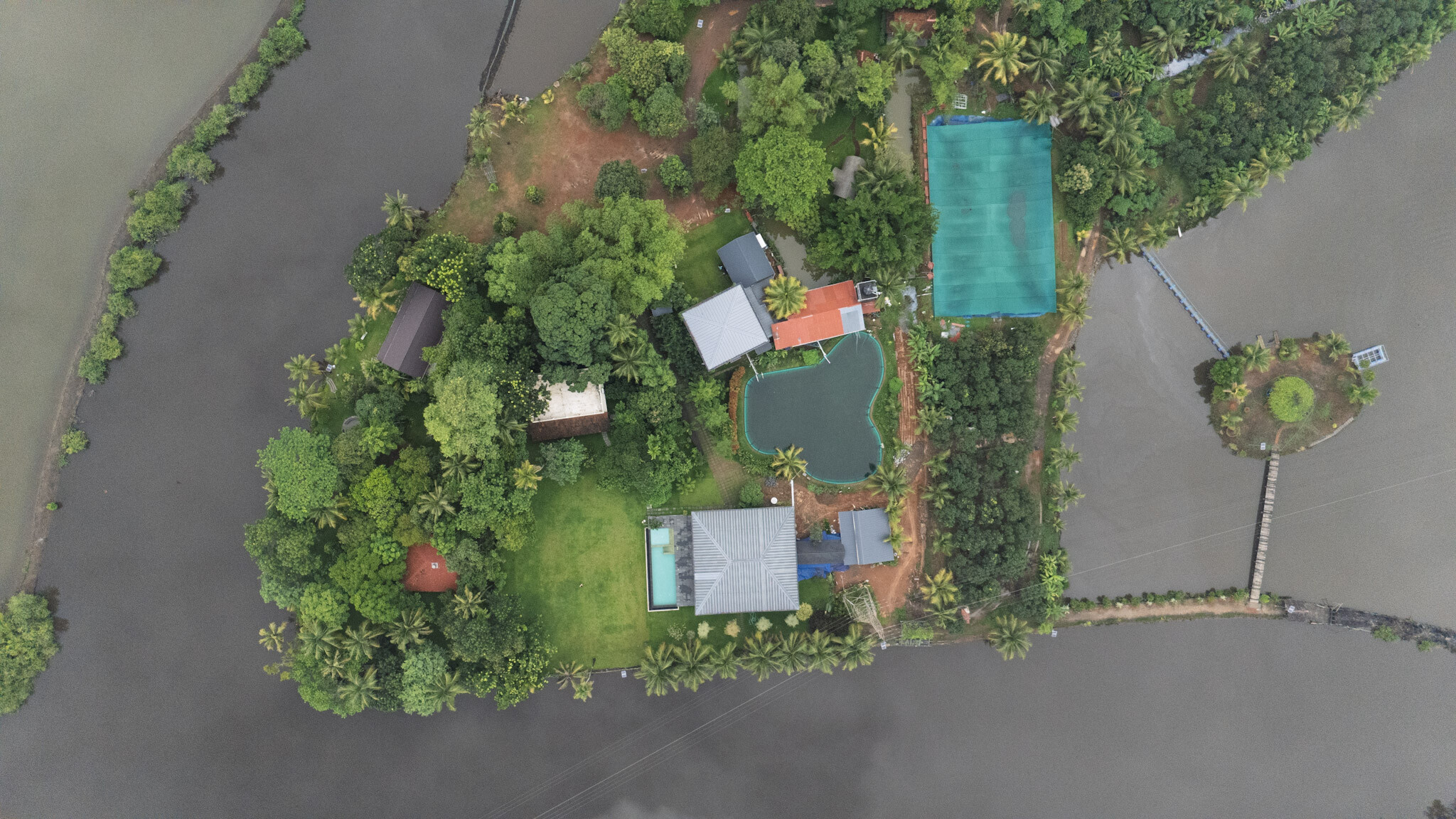 Aerial view of Giby Farm island cottages and surrounding backwater